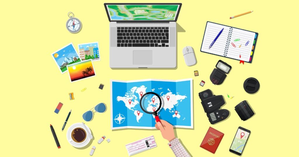 パソコンの前で旅行の計画を立てている画像